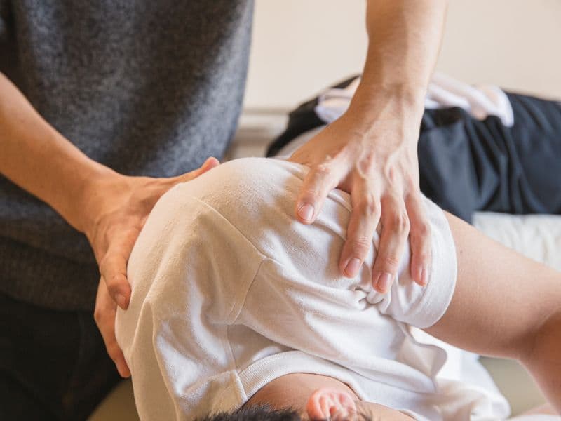 Physiotherapist working with a patient during rehabilitation